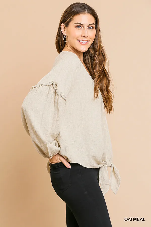 Linen blend long puff sleeve button front V-neck top with center knot and ruffle details